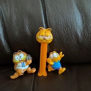 Garfield vintage Pez dispenser and two figures.